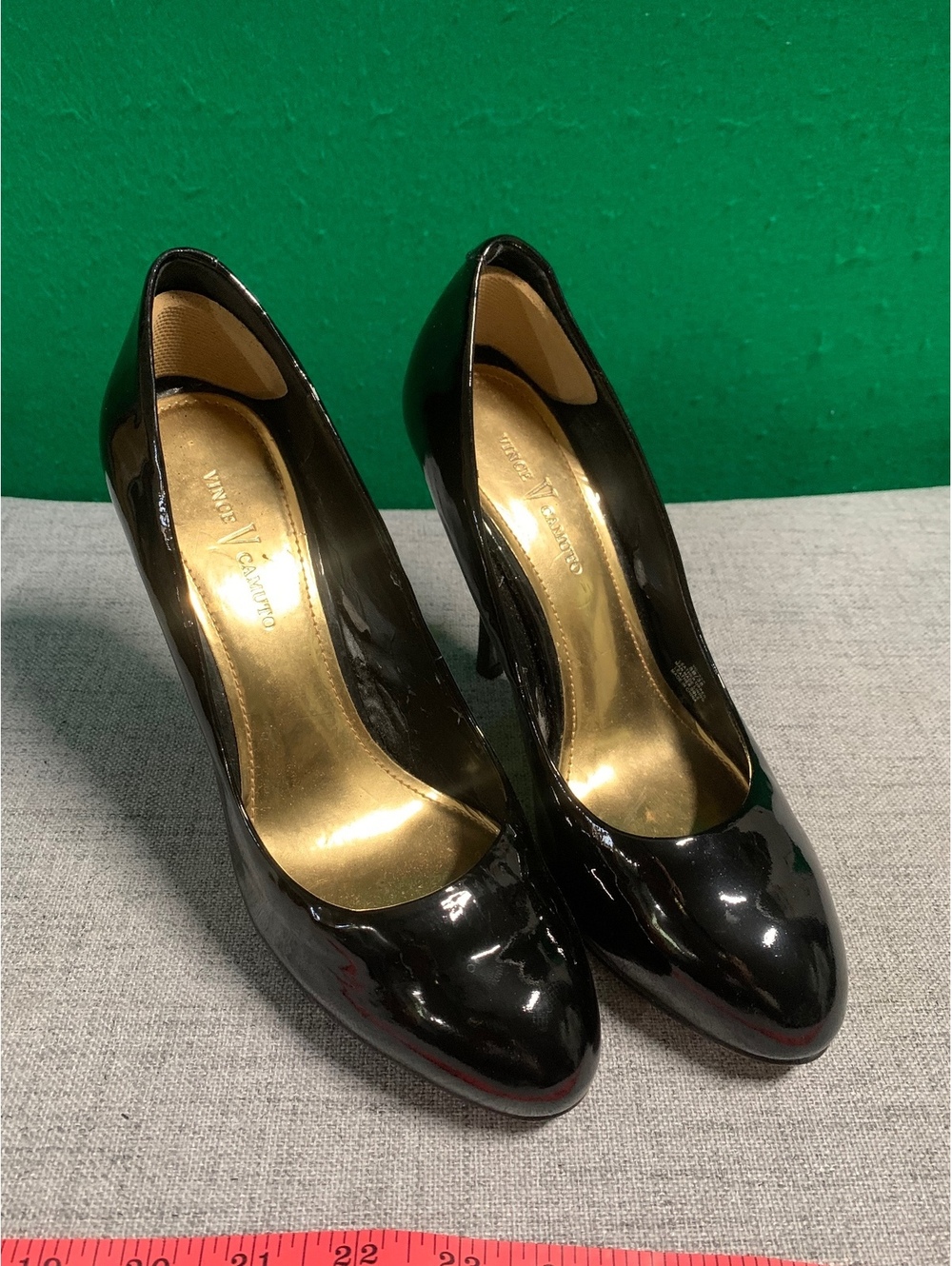Vince black patent pumps